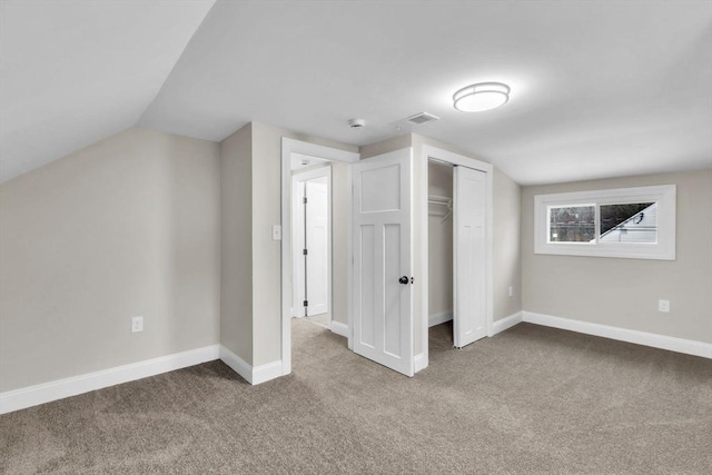 additional living space with lofted ceiling and carpet floors