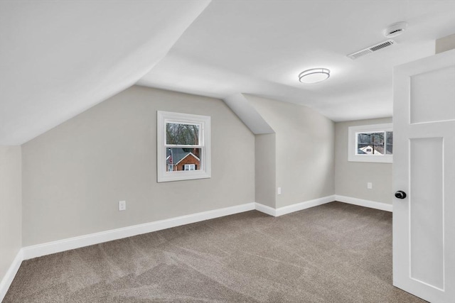 bonus room featuring carpet and lofted ceiling