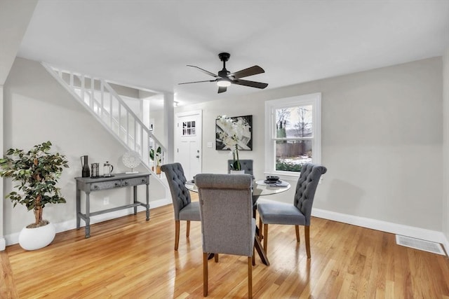 dining room featuring hardwood / wood-style flooring and ceiling fan