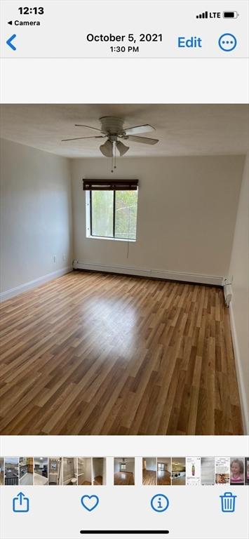 unfurnished room featuring hardwood / wood-style flooring and ceiling fan