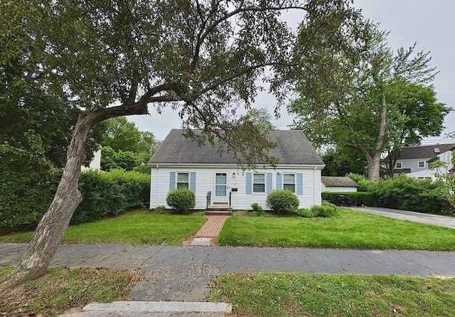 33 Meadowbrook Rd, Brookline, MA 02467 - new england style home featuring a front lawn