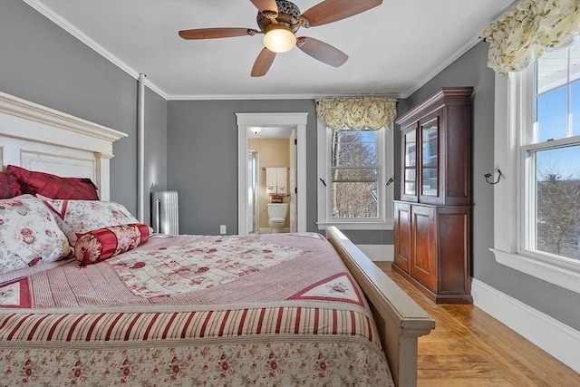 bedroom featuring ensuite bathroom, radiator, ornamental molding, ceiling fan, and light wood-type flooring