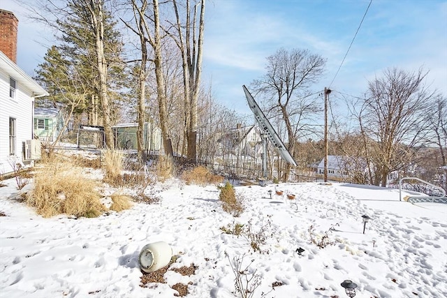 view of yard covered in snow