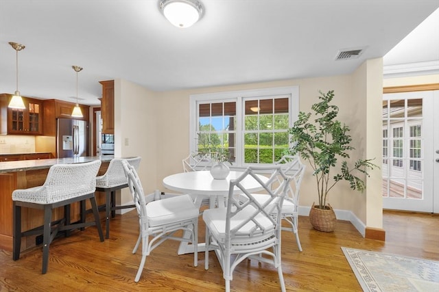 15 Hawthorne Rd, Hingham, MA 02043 - dining area with light wood-style floors and baseboards