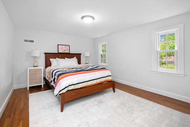 15 Hawthorne Rd, Hingham, MA 02043 - bedroom with wood finished floors, multiple windows, and baseboards