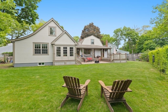 15 Hawthorne Rd, Hingham, MA 02043 - back of property with an outdoor fire pit and a patio area
