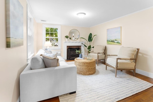 15 Hawthorne Rd, Hingham, MA 02043 - living room featuring wood finished floors, baseboards, a fireplace, and crown molding