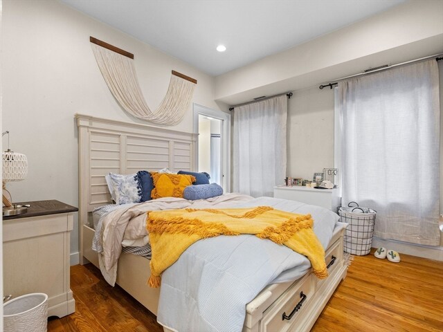 bedroom with hardwood / wood-style floors