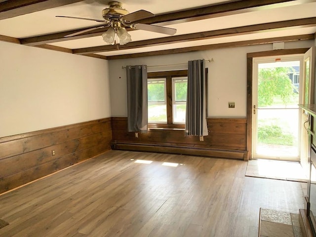 19 Locust Ave, Southbridge, MA 01550 - spare room with a wainscoted wall, healthy amount of natural light, beam ceiling, wood finished floors, and ceiling fan
