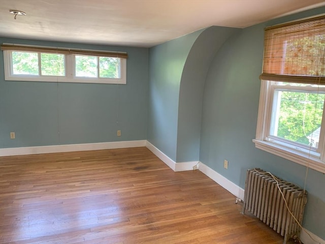 19 Locust Ave, Southbridge, MA 01550 - empty room with radiator and wood finished floors