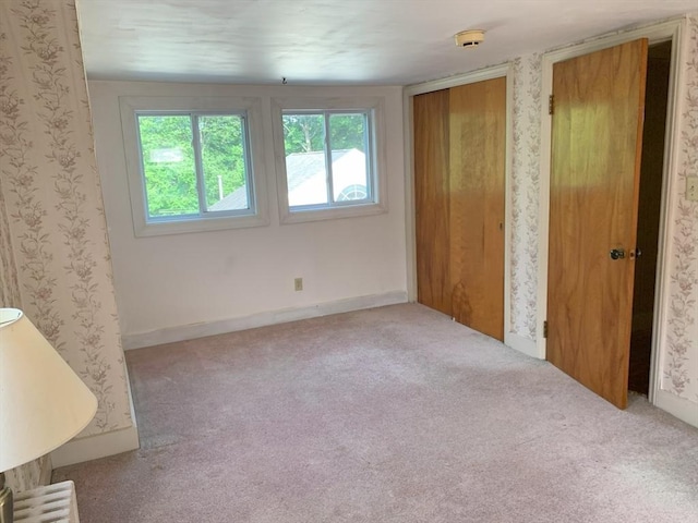 19 Locust Ave, Southbridge, MA 01550 - unfurnished bedroom with carpet floors and wallpapered walls