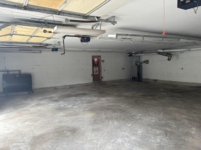 19 Locust Ave, Southbridge, MA 01550 - garage featuring a garage door opener and heating fuel