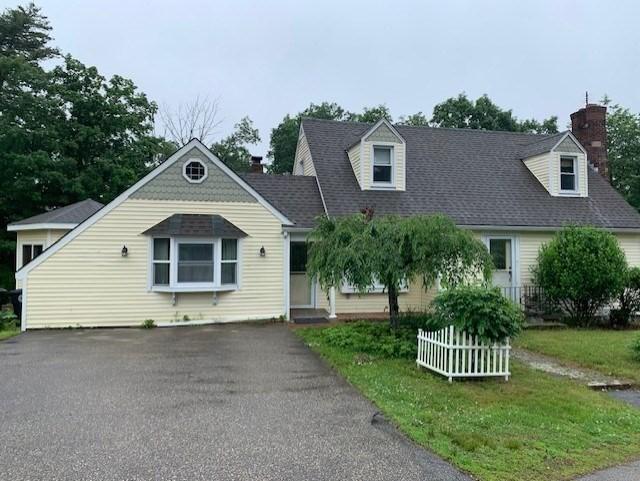 19 Locust Ave, Southbridge, MA 01550 - view of front facade with a chimney and a shingled roof