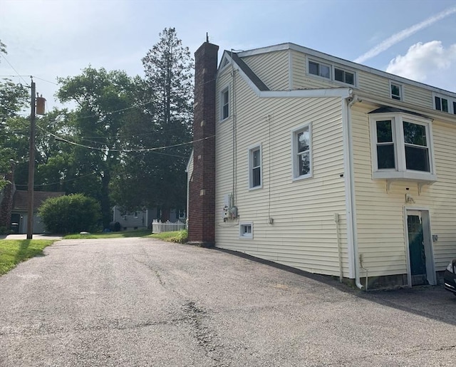 19 Locust Ave, Southbridge, MA 01550 - view of side of home with a chimney