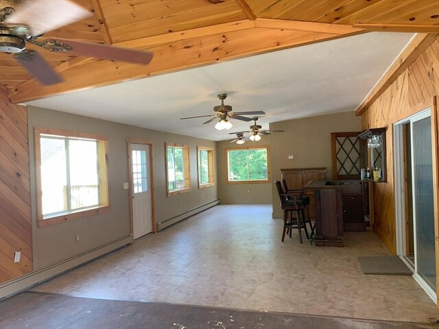 19 Locust Ave, Southbridge, MA 01550 - dining room featuring baseboard heating, a ceiling fan, wood walls, tile patterned floors, and beam ceiling