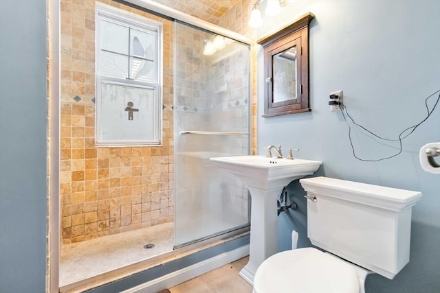 full bath with a stall shower and toilet