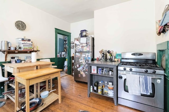 kitchen with wood-type flooring and appliances with stainless steel finishes