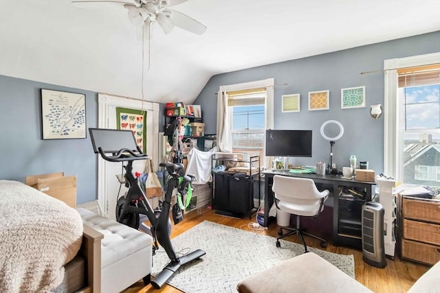 home office with ceiling fan, wood finished floors, and lofted ceiling