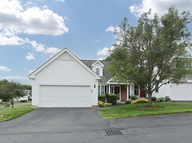 38 Nature View Dr Unit 38, Uxbridge, MA 01569 - view of front of home with asphalt driveway, a front yard, and a garage