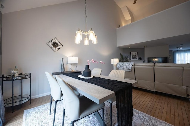 38 Nature View Dr Unit 38, Uxbridge, MA 01569 - dining area with a chandelier, lofted ceiling, and wood finished floors