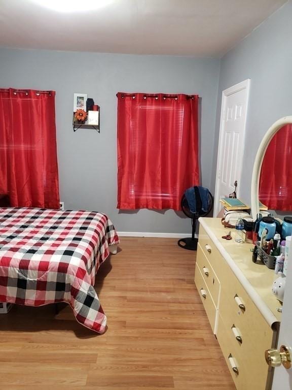 bedroom with light hardwood / wood-style flooring