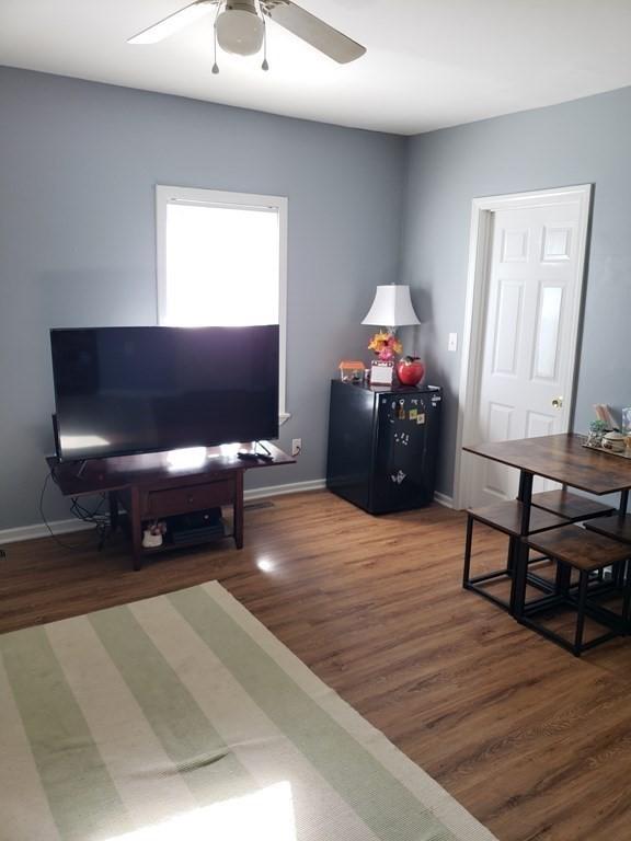 interior space featuring dark hardwood / wood-style floors and ceiling fan