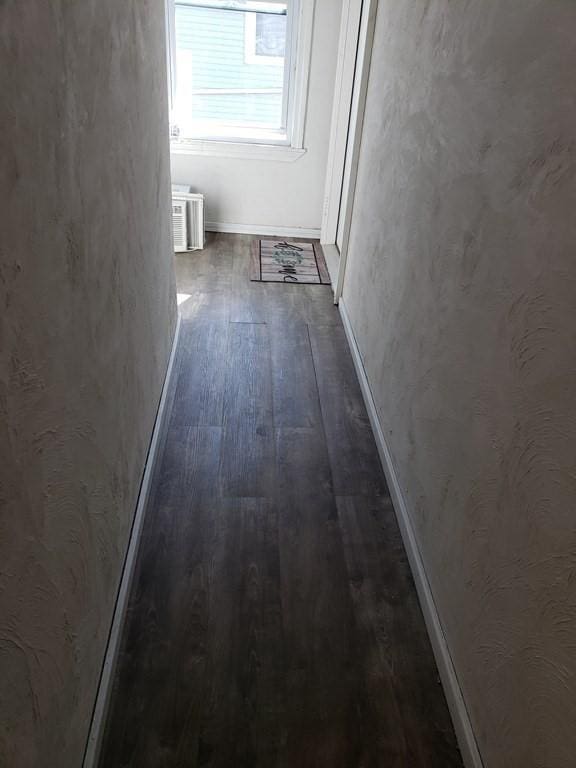 hallway featuring dark hardwood / wood-style floors