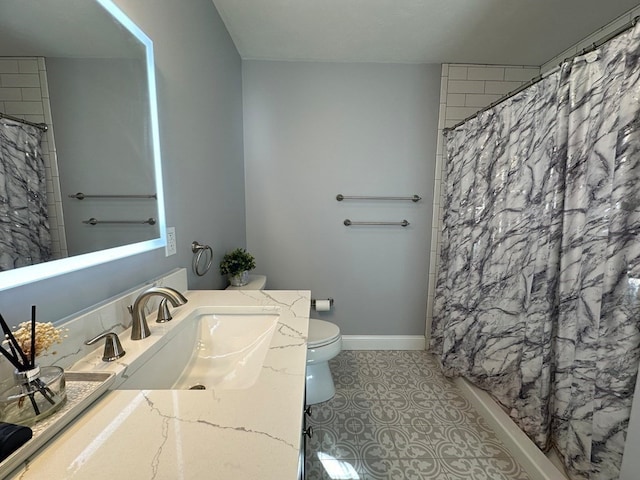 bathroom with vanity, curtained shower, toilet, and tile patterned floors