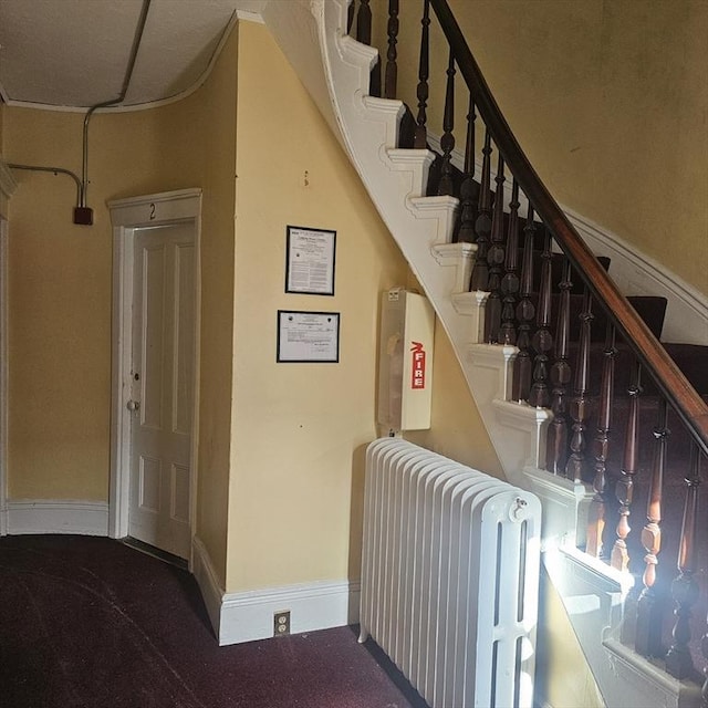 staircase featuring radiator heating unit