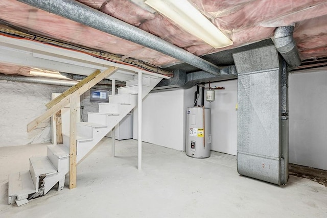 50 Mckinley St Unit 50, Maynard, MA 01754 - unfinished basement with water heater and stairway