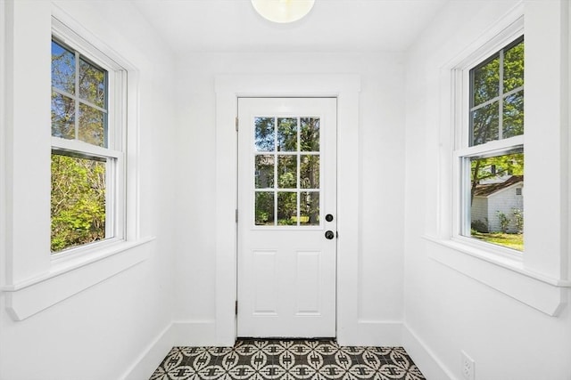 50 Mckinley St Unit 50, Maynard, MA 01754 - doorway with tile patterned floors and baseboards