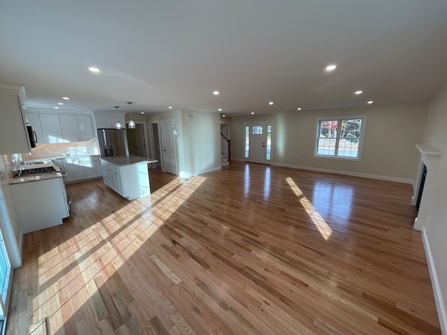 unfurnished living room featuring light hardwood / wood-style floors