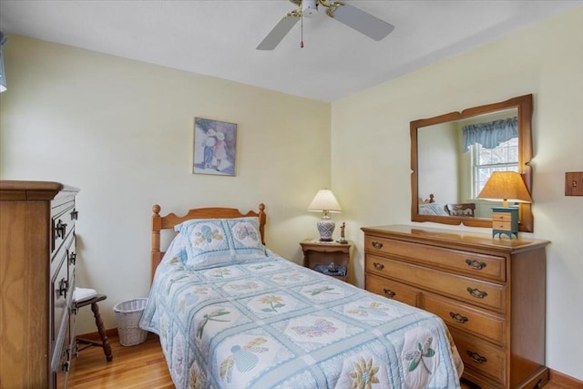 bedroom with a ceiling fan and light wood finished floors