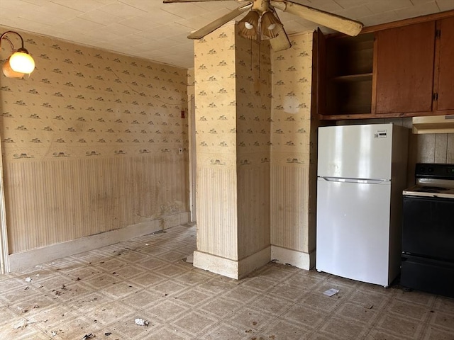 10 Conway Dr, Leicester, MA 01524 - kitchen with electric range oven, freestanding refrigerator, under cabinet range hood, a ceiling fan, and light floors