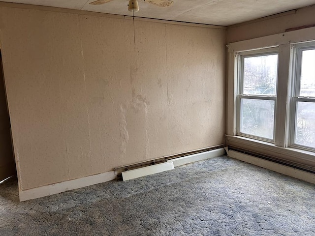 10 Conway Dr, Leicester, MA 01524 - carpeted empty room with healthy amount of natural light, a textured wall, and a ceiling fan