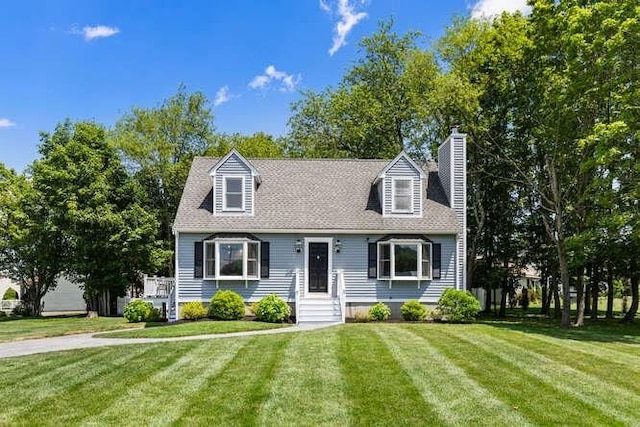 151 Whitehall Rd, Amesbury, MA 01913 - cape cod home with a front lawn and a chimney