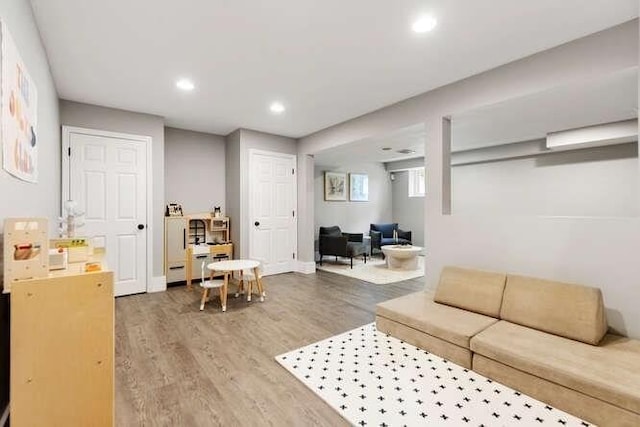 151 Whitehall Rd, Amesbury, MA 01913 - living area with wood finished floors and recessed lighting