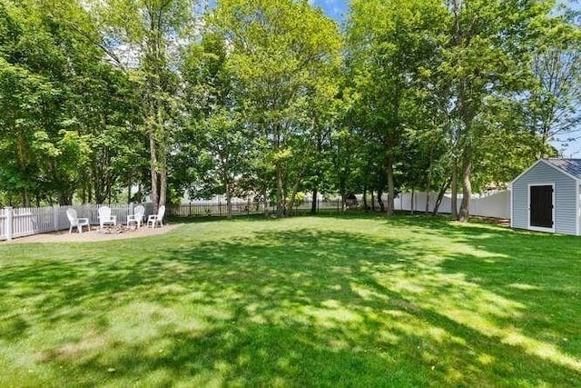 151 Whitehall Rd, Amesbury, MA 01913 - fenced backyard featuring a shed