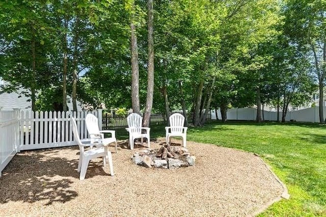151 Whitehall Rd, Amesbury, MA 01913 - fenced backyard with a fire pit