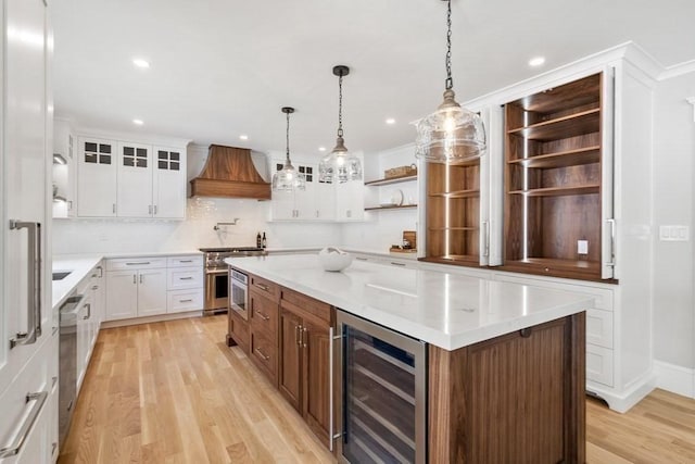 10 Dawson Way, Falmouth, MA 02536 - kitchen featuring wine cooler, open shelves, appliances with stainless steel finishes, custom range hood, and a kitchen island