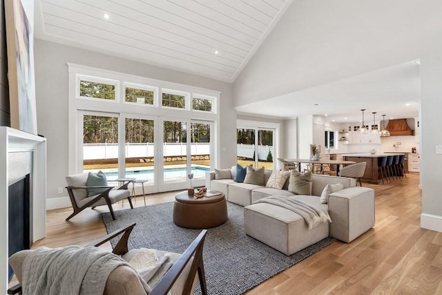 10 Dawson Way, Falmouth, MA 02536 - living room featuring light wood-style flooring, wooden ceiling, recessed lighting, a fireplace, and high vaulted ceiling