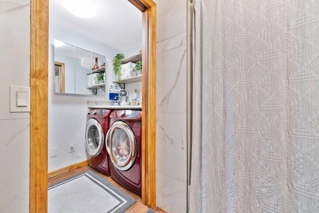 laundry room featuring washer and dryer and laundry area