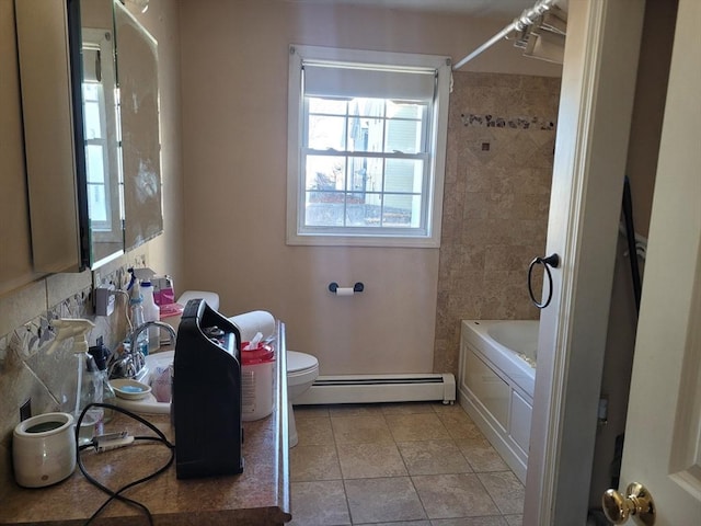 bathroom with tile patterned flooring, a baseboard radiator, washtub / shower combination, and toilet