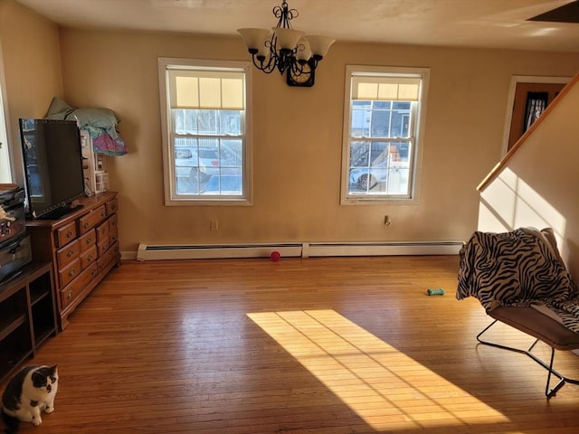 living room featuring a notable chandelier and wood-type flooring