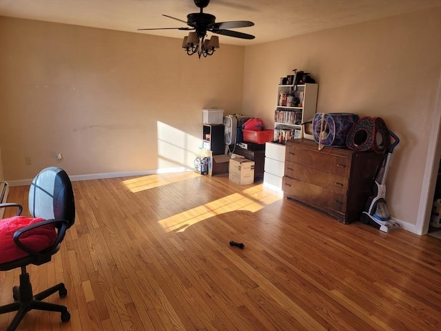 interior space with ceiling fan and light hardwood / wood-style flooring