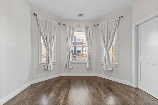 unfurnished room featuring dark wood-type flooring