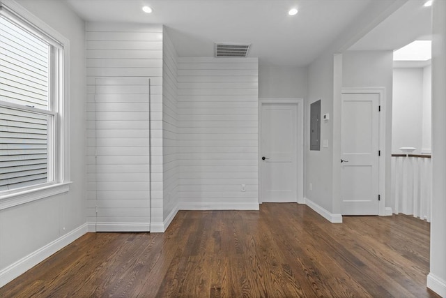 spare room featuring dark wood-type flooring