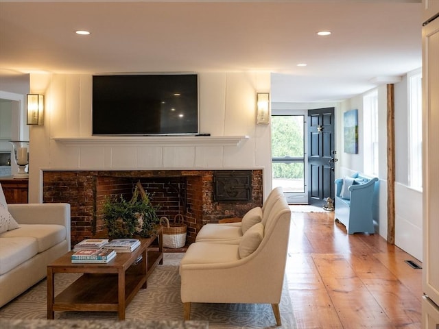 205 Powder Point Ave, Duxbury, MA 02332 - living room featuring visible vents, recessed lighting, a brick fireplace, and wood-type flooring