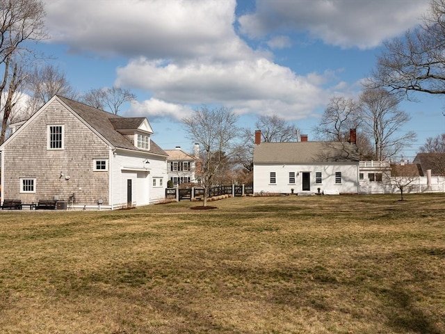 205 Powder Point Ave, Duxbury, MA 02332 - back of house with fence and a lawn