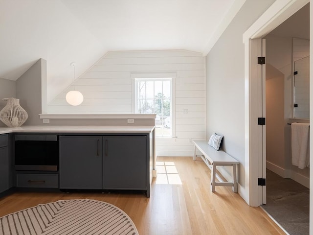 205 Powder Point Ave, Duxbury, MA 02332 - interior space featuring gray cabinets, light countertops, lofted ceiling, baseboards, and light wood-style floors